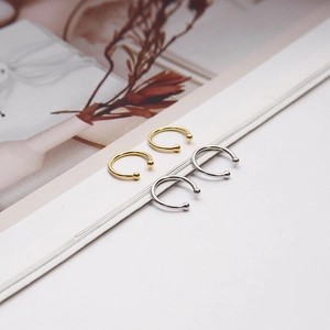 Detailed view of minimalist S925 sterling silver ear cuffs in gold and silver finishes