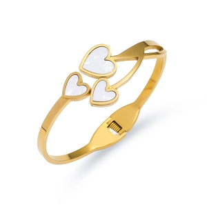 Detail of gold-plated bangle showing triple white heart inlays and side spring clasp