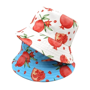 Double-sided sun hat with pomegranate print in white and sky blue for summer travel