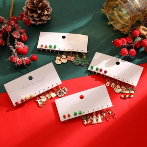 Detail of Christmas earring sets featuring Santa, reindeer, and snowflakes on a card