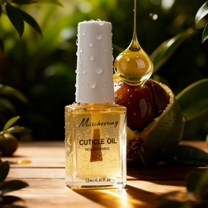 Macro of Misscheering cuticle oil bottle with golden liquid and floating drops on wood