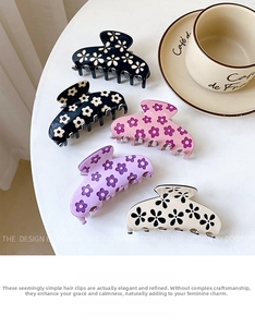 Detailed set of large floral pattern hair claws in black, blue, pink, purple and cream
