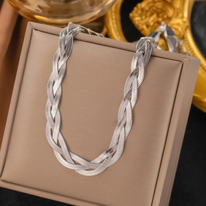 Silver multi-strand braided snake chain necklace presented on a beige jewelry box