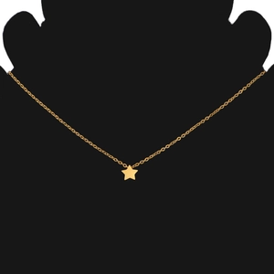 Minimalist gold star pendant on delicate necklace displayed on black bust mannequin