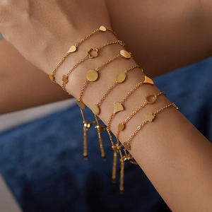 Minimalist 18K gold plated titanium steel bracelet set with assorted geometric charms