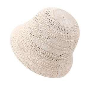 Women's foldable crochet bucket hat in beige with hollow knit for summer sun protection
