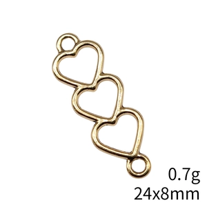 Macro shot of 24x8mm golden hollow triple heart connector for DIY jewelry making