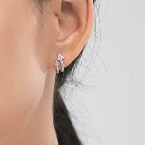 S925 sterling silver arrow earrings with sparkling pavé zircons worn by model