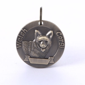 Detailed relief of a Welsh Corgi on a round antique bronze metal pet ID tag
