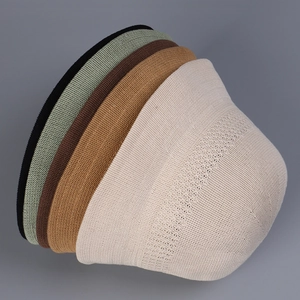 Stack of breathable knitted bucket hats in five different colors for summer sun protection