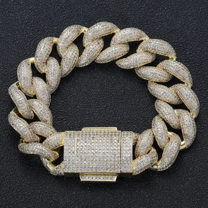 Luxurious 18mm golden bubble Cuban link bracelet with iced-out pave zircons on black background