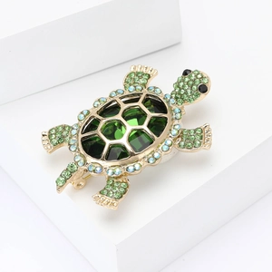 Elegant gold-tone turtle brooch with sparkling green and black rhinestones for clothing