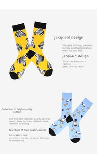 Detail of cotton crew socks featuring yellow zebra and blue space shuttle jacquard patterns
