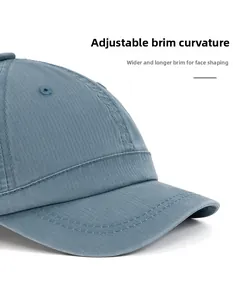 Detail of blue baseball cap showing foldable wide brim and reinforced stitching