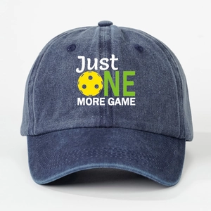 Navy blue washed cotton baseball cap with Just One More Game pickleball print