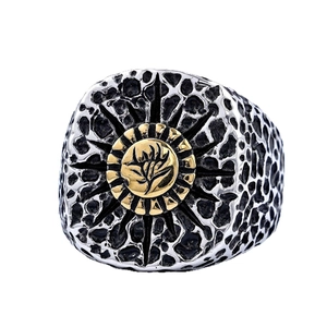 Retro punk skull ring in antique silver with golden sun emblem and textured surface
