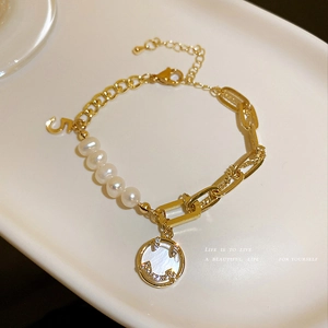 Elegant gold chain and pearl bracelet with crystal smiley face and number 5 charms