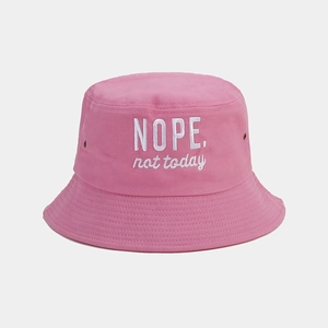 Detail of pink cotton bucket hat with NOPE. not today embroidery and metal eyelet