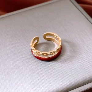 Macro shot of gold-plated double-layer chain ring with red enamel and S925 stamp