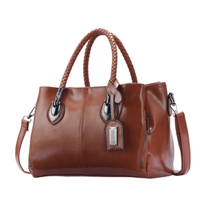 Retro brown leather Boston bag for women with woven handles and adjustable shoulder strap