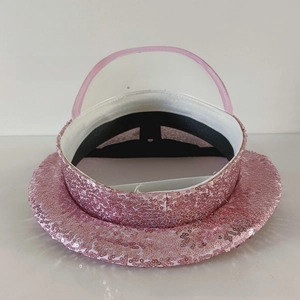 Detail view of pink sequin military hat interior showing white lining and structure