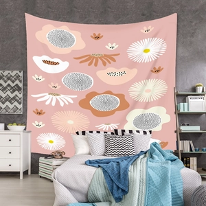 Detailed view of bohemian floral tapestry hanging on bedroom wall for cozy home decoration