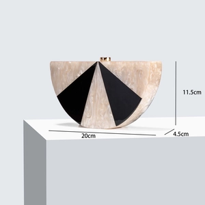 Detail view of semi-circular acrylic clutch dimensions 20cm x 11.5cm x 4.5cm