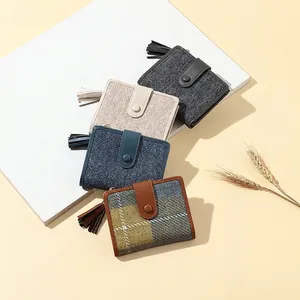 Women's minimalist short tassel wallets in fabric and faux leather, set of four styles
