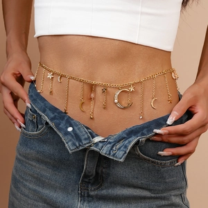 Detail view of golden star and moon waist chain with crystal and pearl pendants