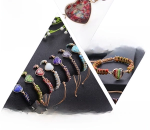 Detailed view of handmade chakra bracelets featuring various natural heart stones and cords