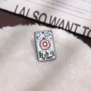 Creative tarot card enamel pin with pink donut and cactus illustration for bags