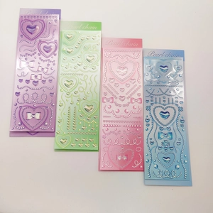 Detailed view of 3D embossed heart stickers with pearl chains in four pastel colors