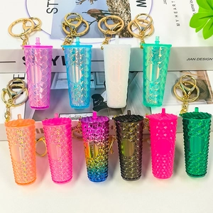 Miniature coffee cup keychains with studded and fish scale patterns in various colors