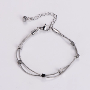 Detail of silver double-layered snake chain bracelet with square sliders and lobster clasp