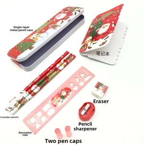 Detail view of 7-piece Christmas stationery set with Santa pencil case and notebook