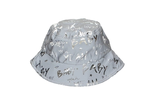 Detail of reflective grey bucket hat featuring metallic BABY and YEAH pattern print