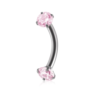 Curved stainless steel barbell piercing with two sparkling pink zircon stones