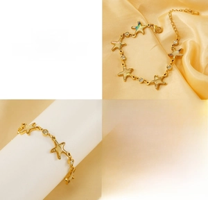 Detailed macro view of gold plated starfish bracelet with mother of pearl shell inlay
