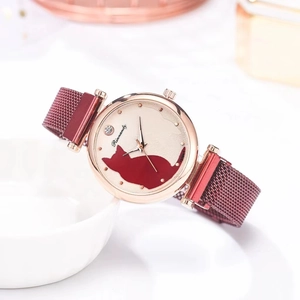 Detail of red cat pattern dial on rose gold watch with magnetic mesh strap