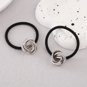 Set of two black high-elastic hair ties featuring elegant silver metal knotted charms