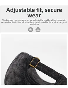Macro detail of antique bronze metal buckle on dark grey vintage washed denim baseball cap