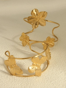 Detailed close-up of 18k gold plated stainless steel butterfly floral wrap bracelet