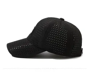 Detail of laser-cut perforations on black breathable quick-dry sports baseball cap
