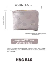 Detail view of jacquard swan makeup bag showing 26x18cm size and canvas lining