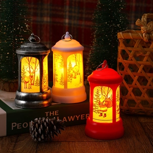 Warm glow from vintage Christmas LED lanterns featuring elk, snowman, and Santa