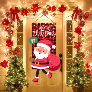 Red and black plaid Merry Christmas door banner with Santa Claus hung on a beige front door