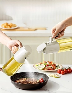 Dual-function kitchen oil dispenser bottle showing mist spray and auto-flip pour modes
