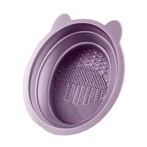 Purple silicone cat-shaped makeup brush cleaning bowl with textured scrubbing surface