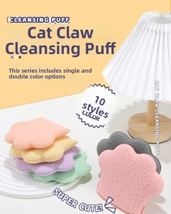 Close-up of cat-paw facial sponges in various colors on a stylish pleated lamp display
