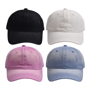 Vintage distressed baseball caps in black, cream, pink, and denim blue wash colors